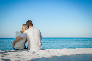 happy loving couple by the sea in the nature