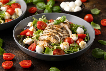 Chicken caprese salad with tomato, mozzarella and balsamic dressing