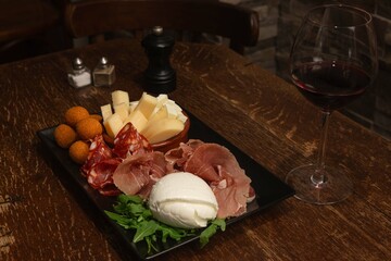 italian appetizer of cold cuts and cheese served on a plate 