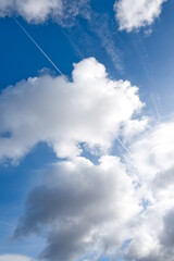 Cloudy sky with contrast between the dark undersides and the illuninated clouds