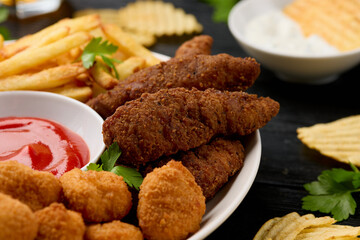 Chicken nuggets, Southern strips, Chicken fingers, french fries, chips, various sauces and beer