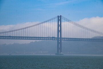 Amazing suspension bridge, Ponte 25 de Abril, Sanctuary of Christ the King, Catholic statue dedicated to the Sacred Heart of Jesus, inspired by Christ the Redeemer of Rio de Janeiro, Lisbon, Portugal.