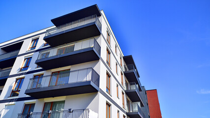 Obraz premium New contemporary residential construction architecture background. Modern house facade exterior.