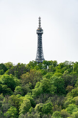 Prague, Czech Republic - Petrin observation tower in Prague located in a park among trees on a hill above the city.