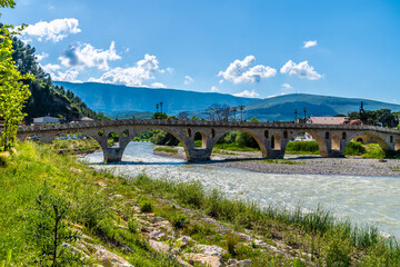 A view over the River Osum along the Gorica bridge in Berat, Albania in summertime