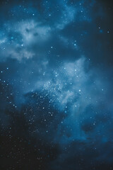 Vertical image capturing the beauty of a twinkling star-filled night sky amidst ethereal clouds