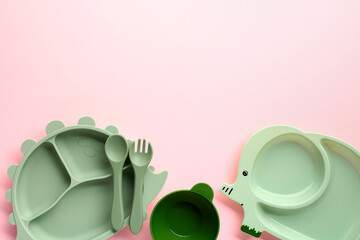 Eco-friendly childrens dining set with dinosaur-themed plate, elephant-shaped plate, bowl, and...