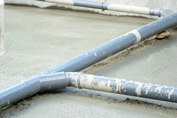 PVC plastic pipe for sewage network in the basement at a construction site