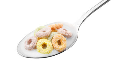 Cereal rings and milk in spoon isolated on white