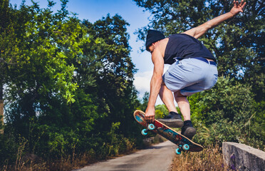 middle age man riding a skate in high jump