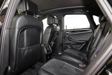 Inside of modern car with black leather seats