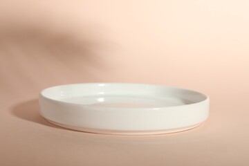 Presentation of product. Podium and shadows on pink background. Space for text