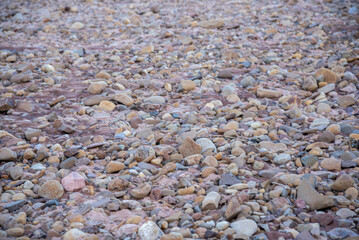 Stones rolled from the river after flooding and torrential rain