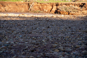 Stones rolled from the river after flooding and torrential rain