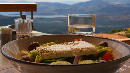 Greek salad with a beautiful mountain view of Greece