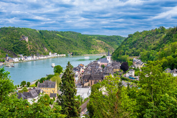 Fototapeta na wymiar View over towns Sankt Goar and Sankt Goarshausen on bank of Rhine River in Rhineland-Palatinate, Germany. Rhine valley is famous tourist destination for romantic river cruise and short vacation