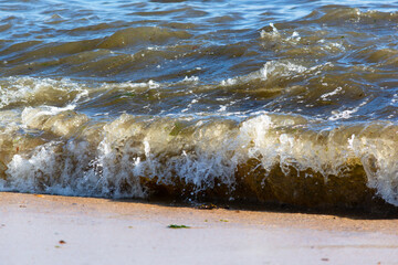 Small waves crashing on the shore.