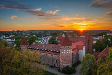 Aerial scenery with the Teutonic Castle in Bytow, a former stronghold for Pomeranian dukes at sunset. Poland