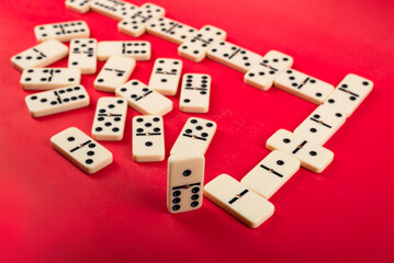 Dominoes on a red background.