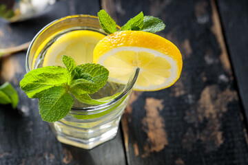 Lemonade with Fresh Mint and Lemon on Old Boards, Healthy Summertime Drink