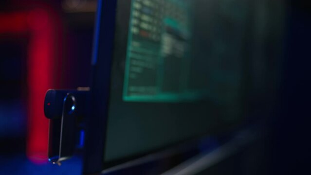 Hacker inserting USB in computer after managing to steal sensitive data, close up. Scammer uploading storage drive into PC after obtaining sensitive information from users using malware, camera B