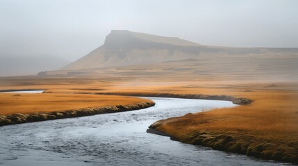 Landscape, A river in Iceland with a mountain on the horizon and a misty atmosphere for serene nature photography