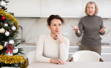 Domestic quarrel between mother and adult daughter during Christmas celebration