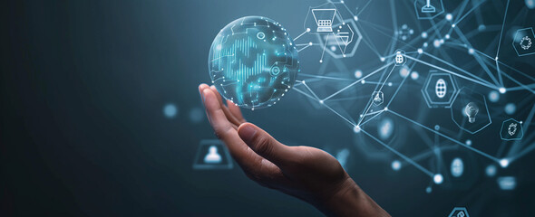 A hand holding futuristic glass sphere with holographic digital icons and data curves in the background, representing advanced technology and global connectivity concept