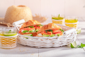 Golden and healthy french croissant with avocado, salmon and dill