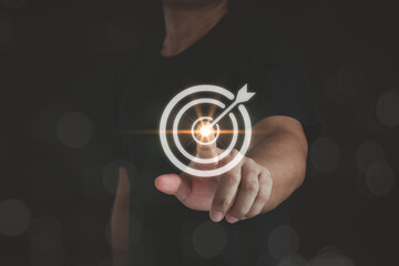 Business achievement goal and objective target concept. Business people pointing a goal and target aim. archery point aim. touching achievement. bullseye strategy for futuristic.