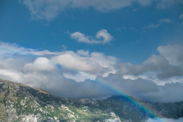 Landscape majestic photo of mountains sky and rainbow 