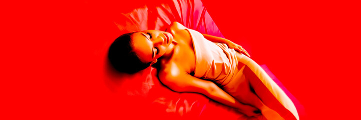 dream fall sleep woman on bed in red light - dynamic silhouette lying down abstract fashion motion