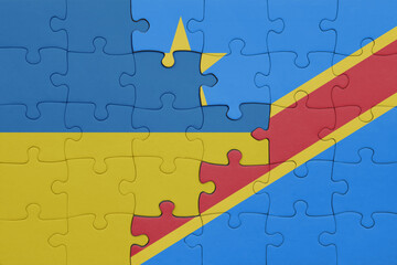 puzzle with the colourful national flag of democratic republic of the congo and flag of ukraine.