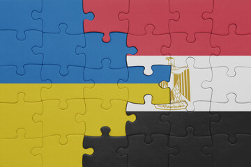 puzzle with the colourful national flag of egypt and flag of ukraine.