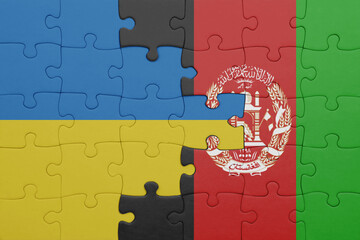puzzle with the colourful national flag of afghanistan and flag of ukraine.