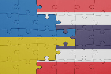 Fototapeta premium puzzle with the colourful national flag of thailand and flag of ukraine.