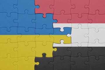 puzzle with the colourful national flag of yemen and flag of ukraine.