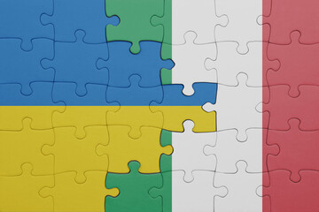 puzzle with the colourful national flag of italy and flag of ukraine.