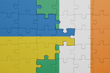 puzzle with the colourful national flag of ireland and flag of ukraine.