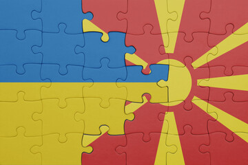 puzzle with the colourful national flag of macedonia and flag of ukraine.