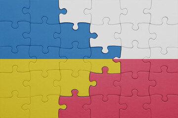 Fototapeta premium puzzle with the colourful national flag of poland and flag of ukraine.