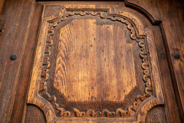 Detail of the carved wood on the door of the church.