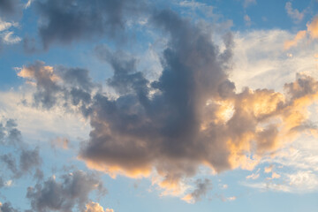 Volumetric clouds illuminated by the sun at sunset