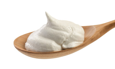 Wooden spoon with sour cream isolated on white