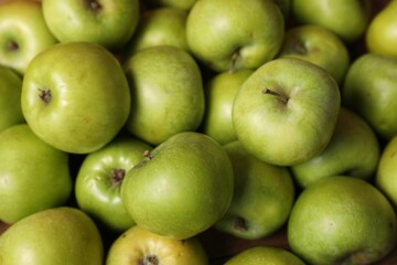 Fresh ripe green apples as background, closeup