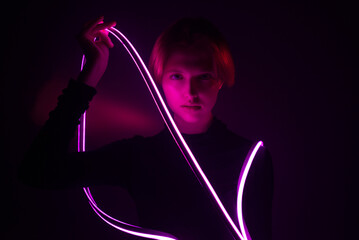 Fototapeta premium young model in cyberpunk fashion style with neon anime