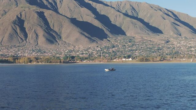 Aerial Tracking Of Fishermen Fishing From Small Boat. Dique la Angostura In Taf&iacute; del Valle, Tucum&aacute;n, Argentina
