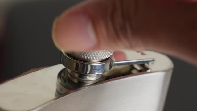 Opening Uncap The Top Cap Of Silver Hip Flask By Hand, Close Up