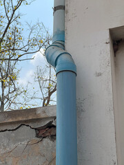 old house near the street with pvc tube