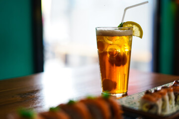 Lychee Iced Tea or Es Leci tea with Mint Leaves in a Glass